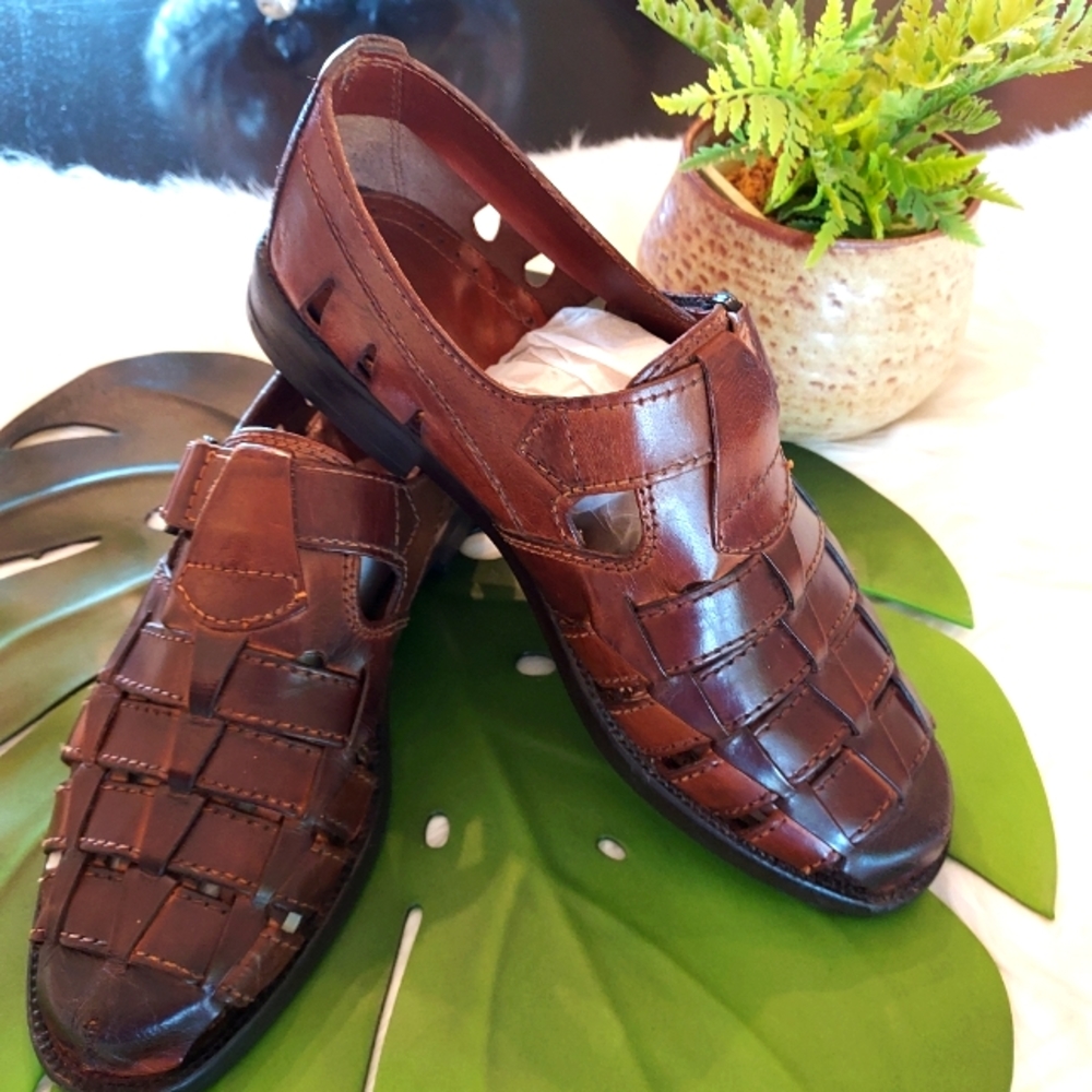 Men's Woodbridge Woven Leather Slip-On Sandals with adjustable Velcro Closures.